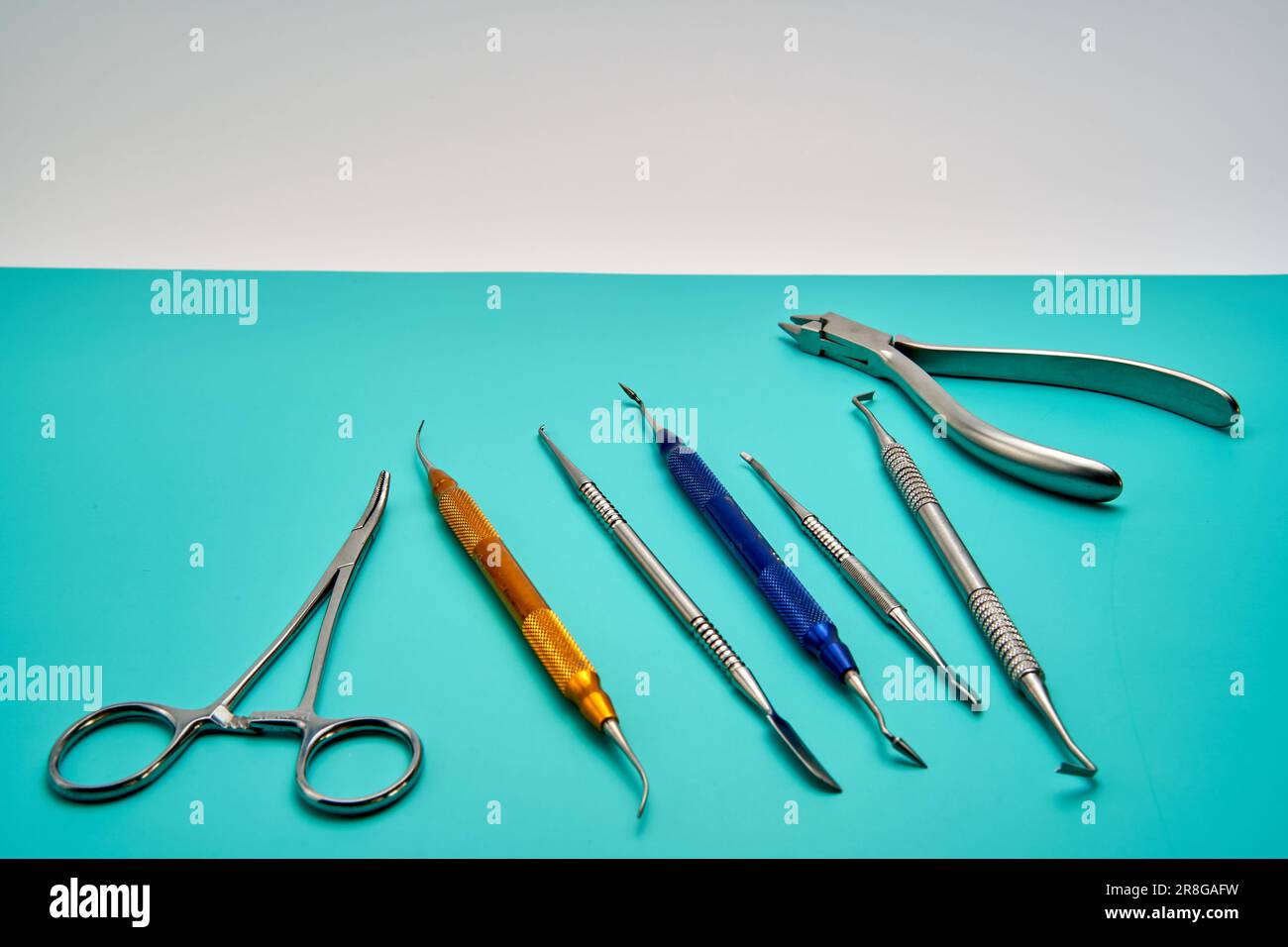Dental Prosthetic Tools on a Greenish Table Stock Photo