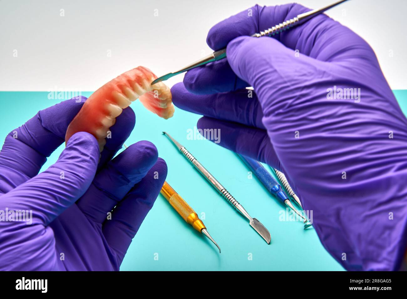 Dental Technician Making New Dental Prosthetics In Laboratory Stock