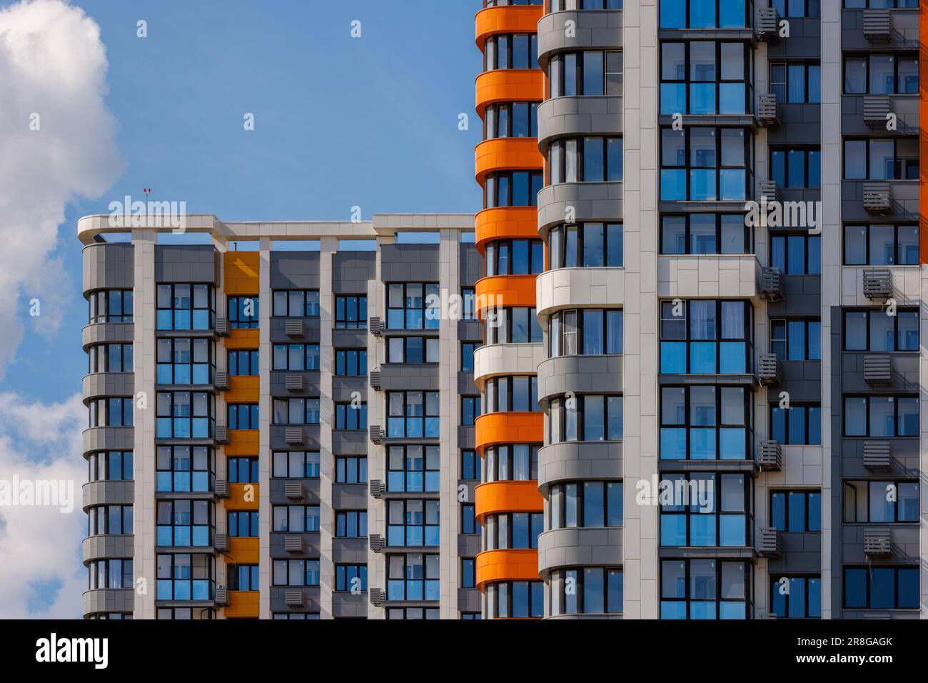 freshly built high rise apartment buildings on blue sky background with ...