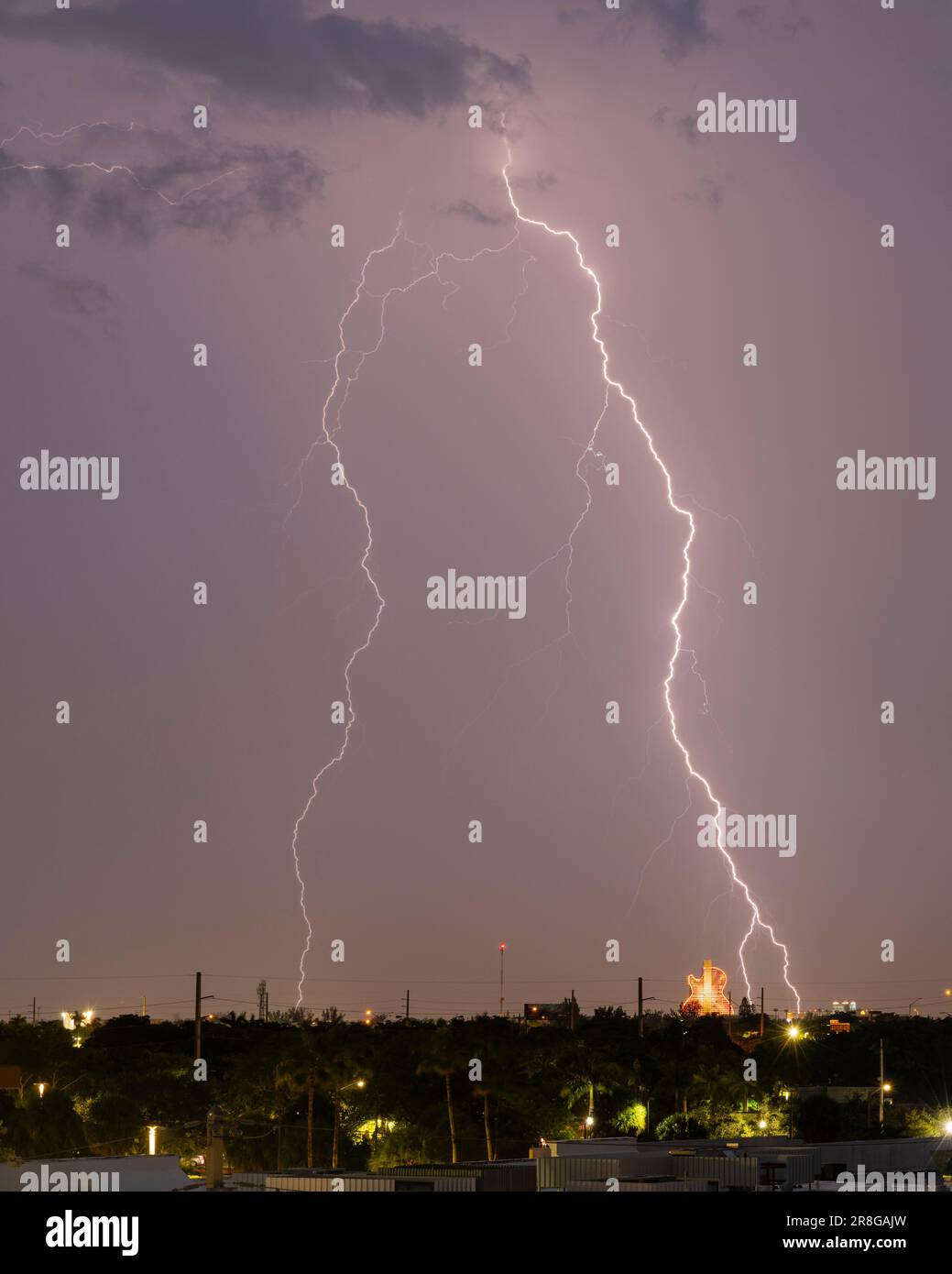 A lighting strikes close to the Hard Rock Guitar Hotel at Hollywood, FL on June 20th, 2023 Stock Photo