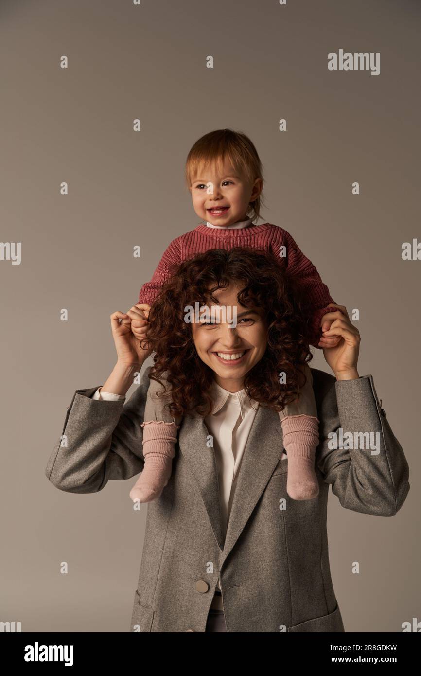 motherhood, work life balance, cheerful working mother with kid on ...
