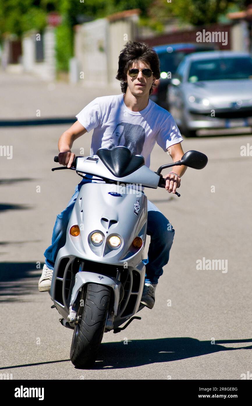 Young Man Driving A Scooter Without Helmet Stock Photo Alamy