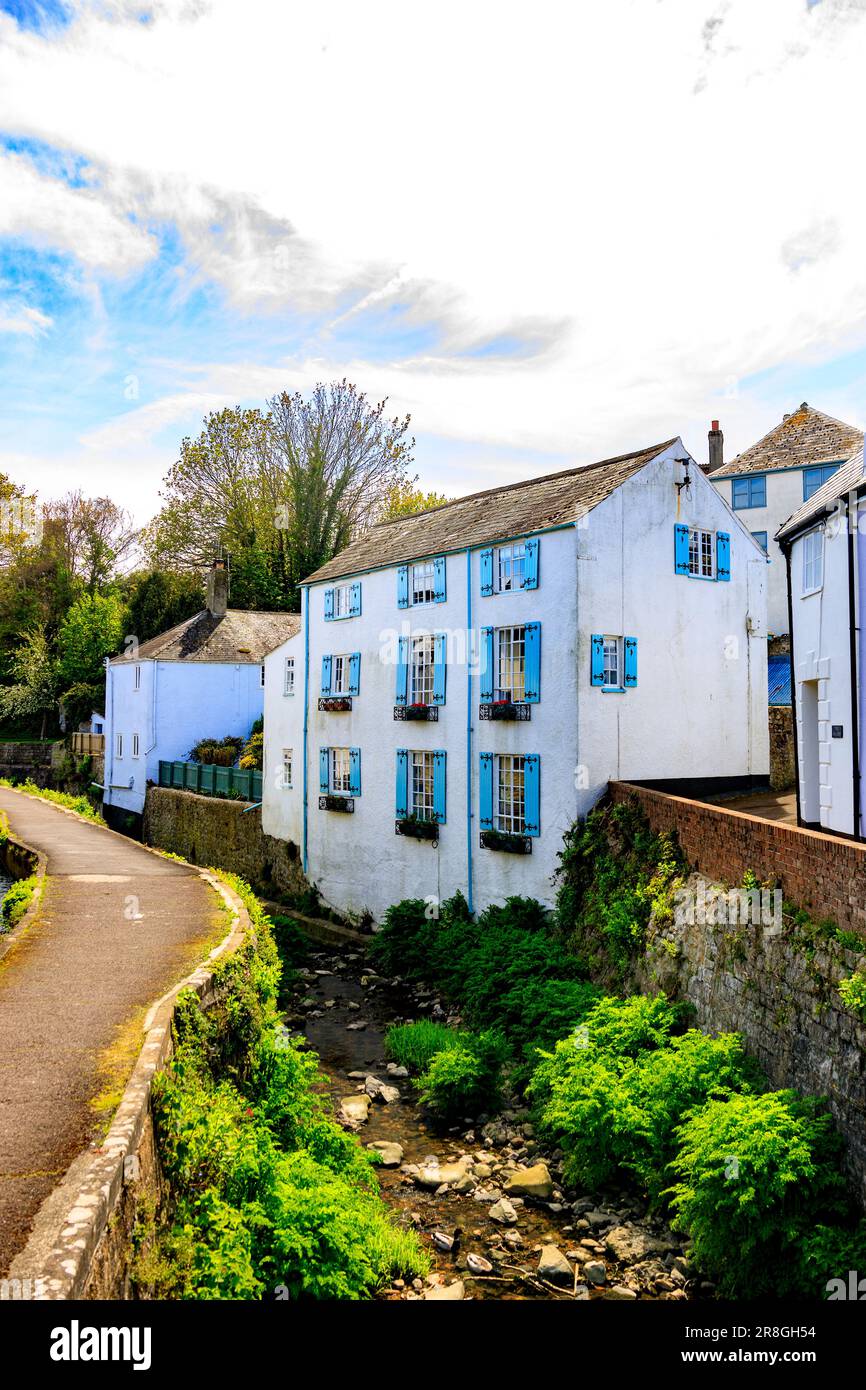 An historic 3 storey house with wooden shutters alongside the River Lim