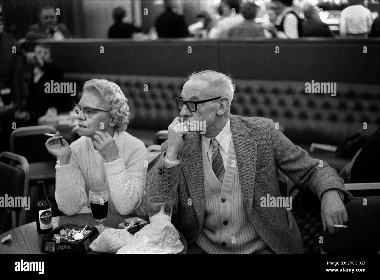 Smoking inside 1980s UK couple looking bored husband and wife. Coventry