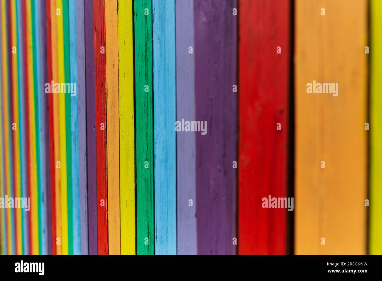 A old fence paint bright colors to make bold pattern Stock Photo Alamy