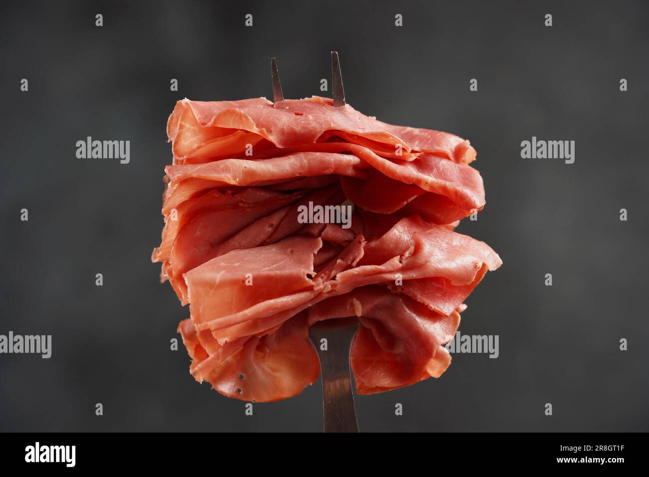 Skewed with a bbq fork dried beef meat with herbs and spicy Stock Photo Alamy