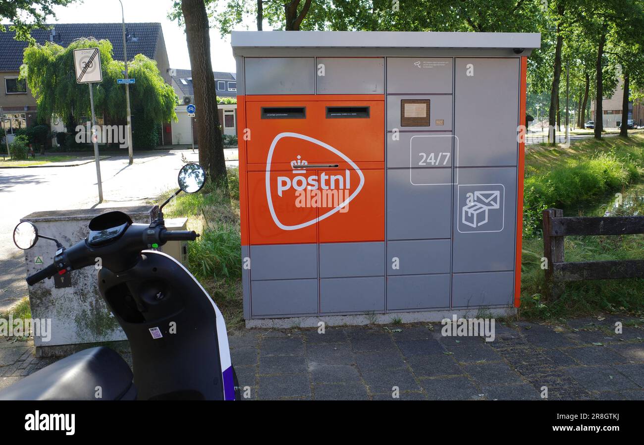 Amersfoort, Netherlands - June 11 2023 The Dutch postal service (Postnl) has placed new mailboxes in cities that combine letterbox and automated parce Stock Photo