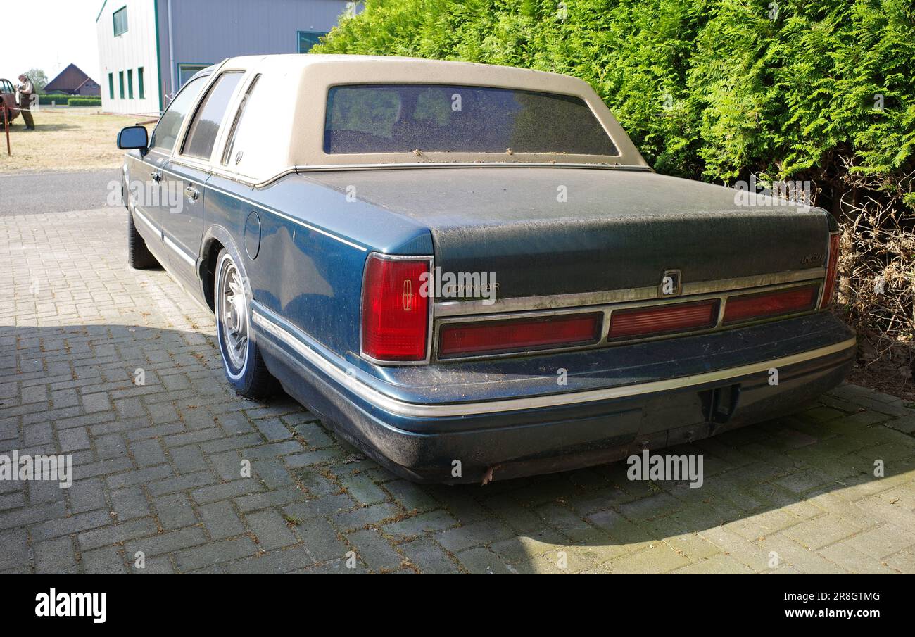 Neulehe, Germany - June 18 2023 A dirty circa 1995 Lincoln Town Car Executive Series is parked. Stock Photo