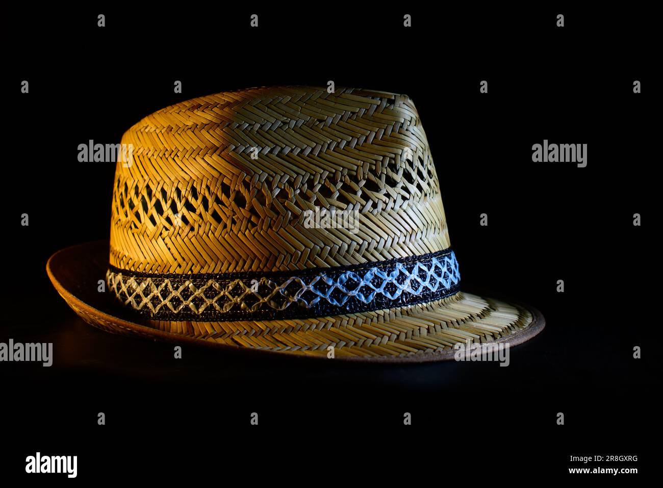 Handmade straw hat isolated on black background Stock Photo
