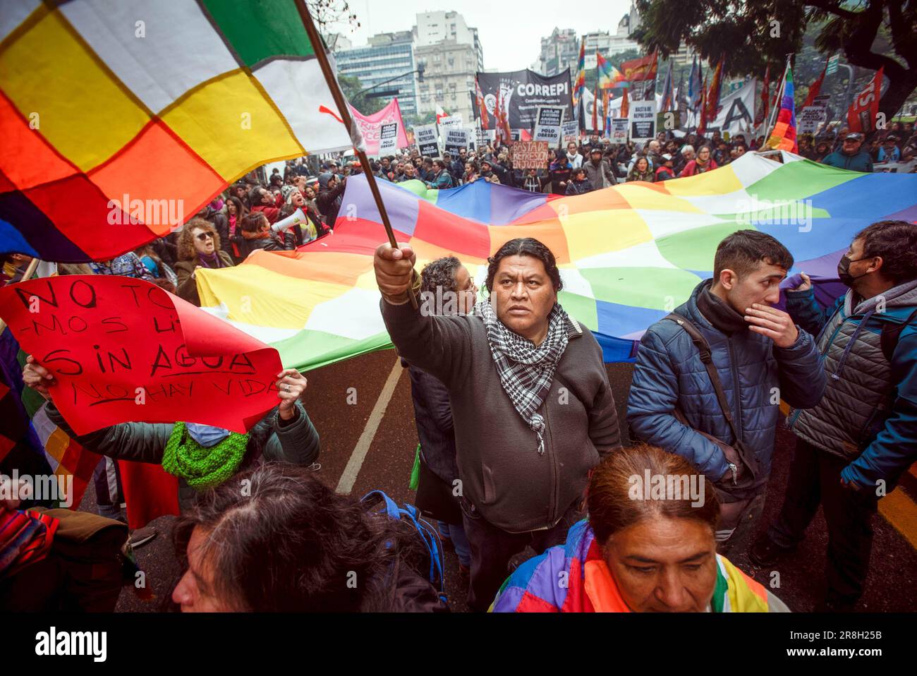 Buenos Aires, Argentina. 20th June, 2023. Protesters hold a Wiphala flag that represents native people of the Andes, near the House of Jujuy during the demonstration. Protests in Jujuy province have erupted in response to a recently approved provincial constitutional reform that critics argue restricts the rights of social protest. Credit: SOPA Images Limited/Alamy Live News Stock Photo