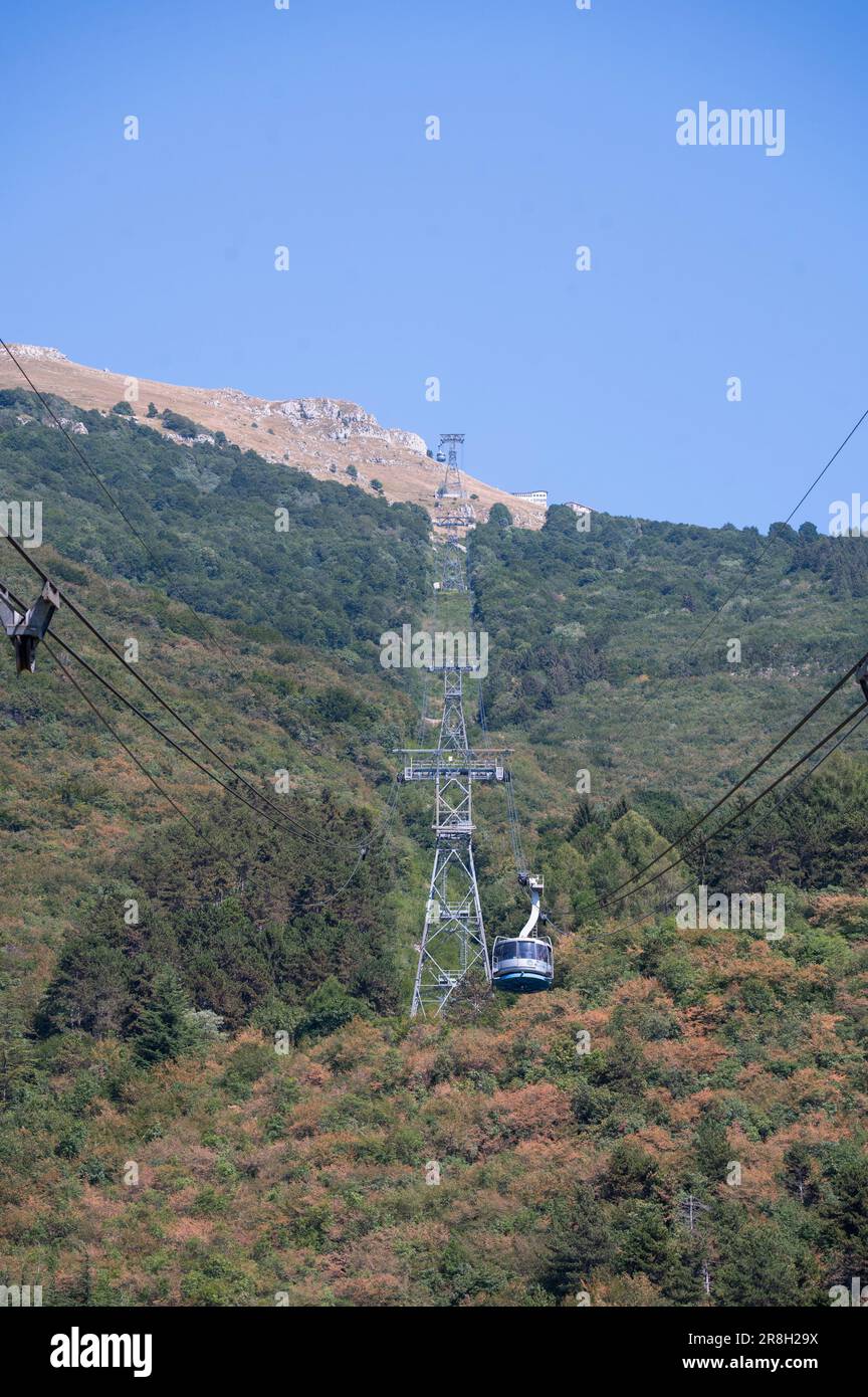 Cable car from Malcesine on the shore of Lake Garda to the top of Monte Baldo mountain above the town Stock Photo