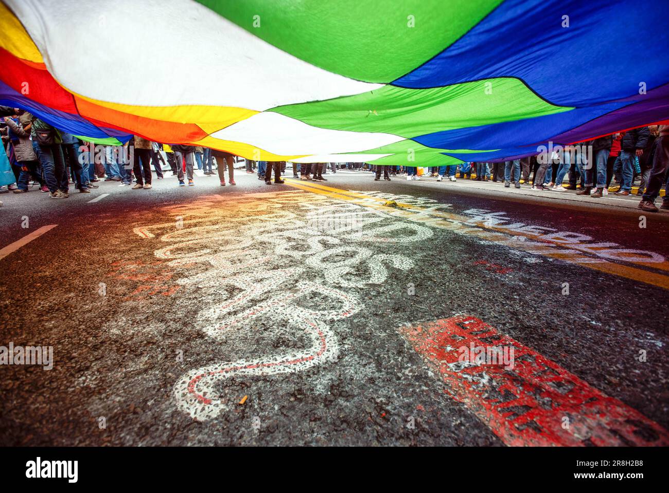 Buenos Aires, Argentina. 20th June, 2023. Protesters hold a Wiphala flag that represents native people of the Andes, near the House of Jujuy during the demonstration. Protests in Jujuy province have erupted in response to a recently approved provincial constitutional reform that critics argue restricts the rights of social protest. (Photo by Mariana Nedelcu/SOPA Images/Sipa USA) Credit: Sipa USA/Alamy Live News Stock Photo