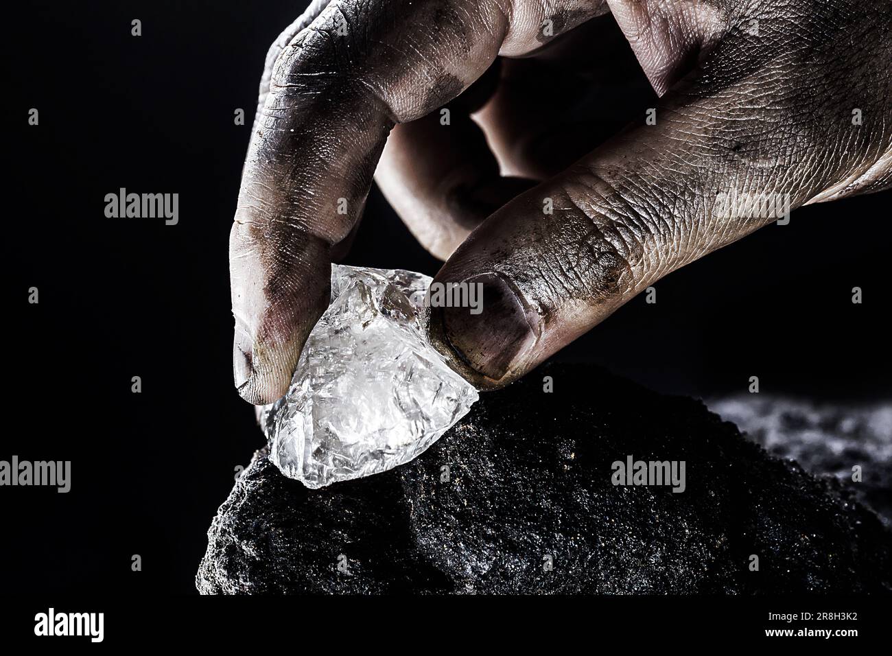hand removing rare stone from a mine, chinese diamond digging Stock Photo