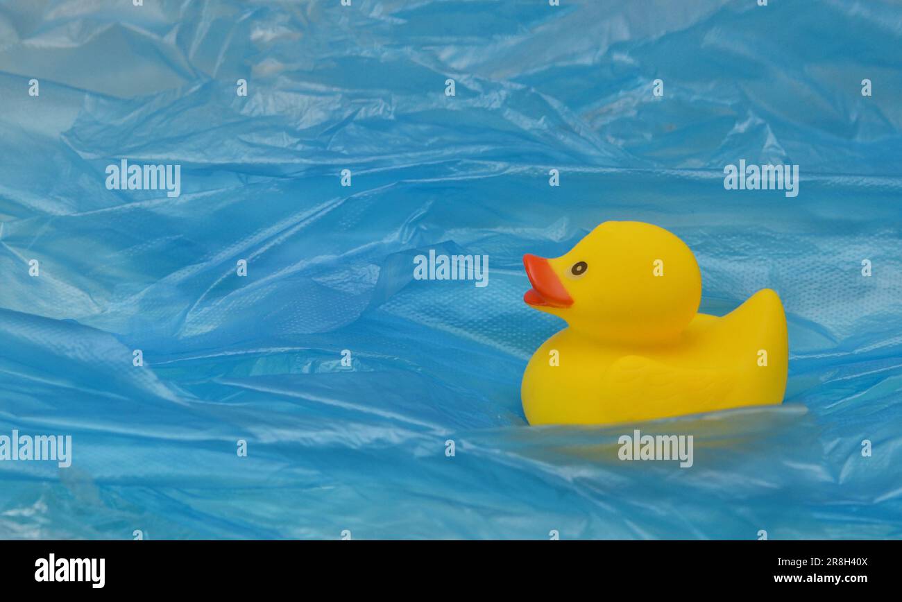 Concept Pollution Plastic In Sea with Yellow Rubber Duck Toy Stock Photo