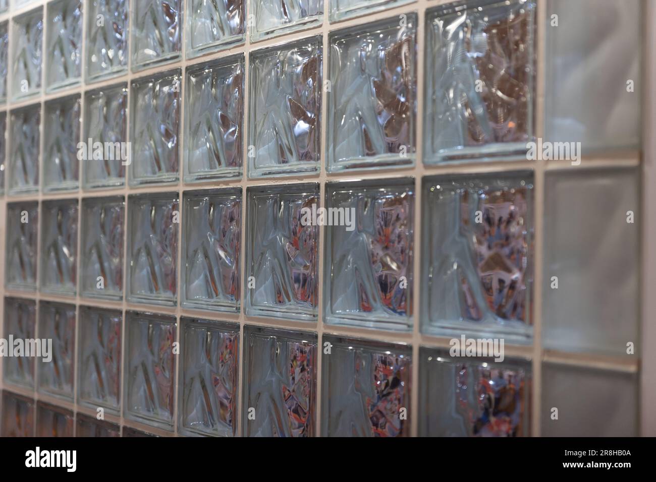 Thick glass block wall background at the expo. Mid shot Stock Photo Alamy