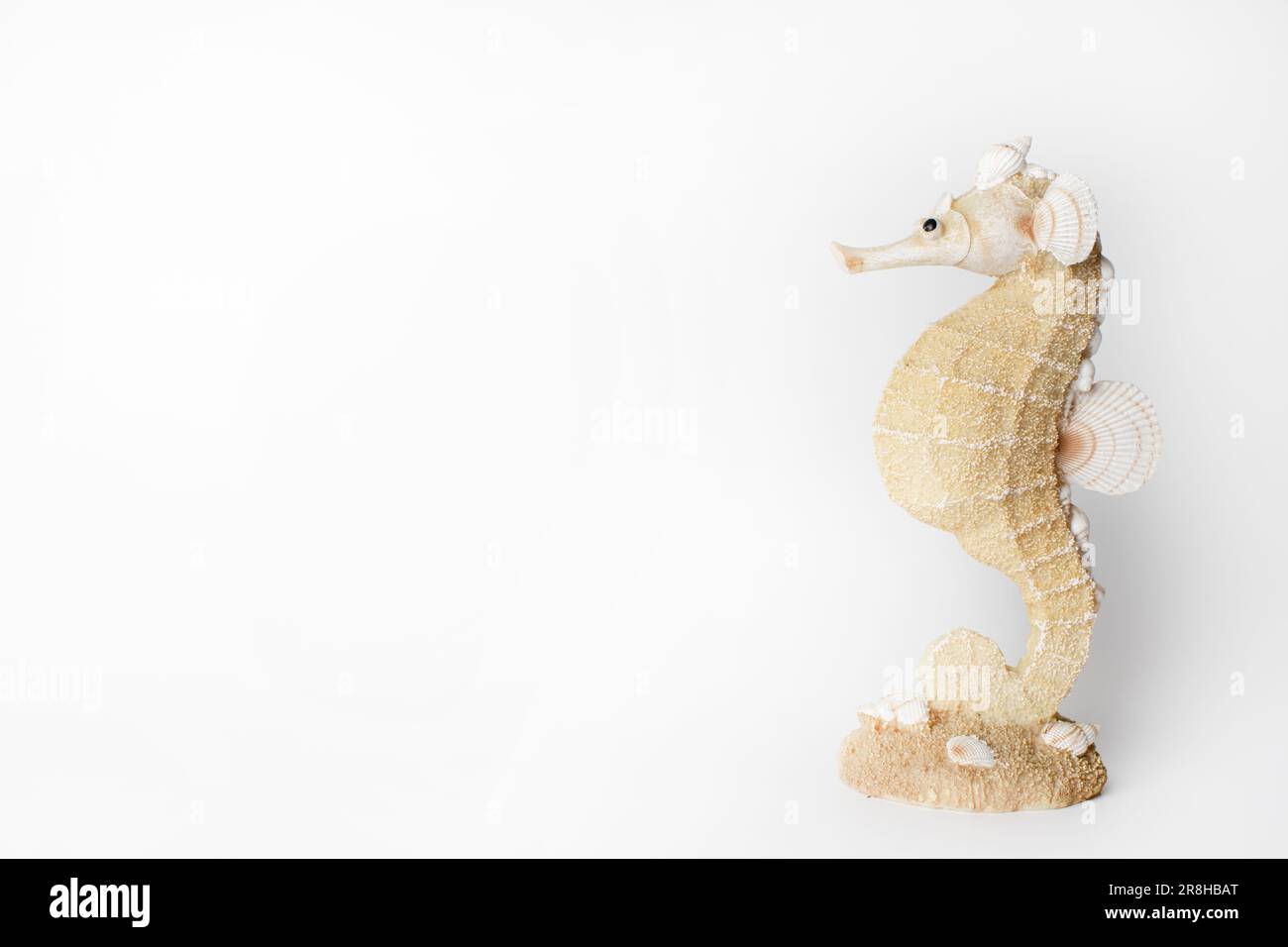Seahorse figurine isolated on the white background. Copy space Stock Photo