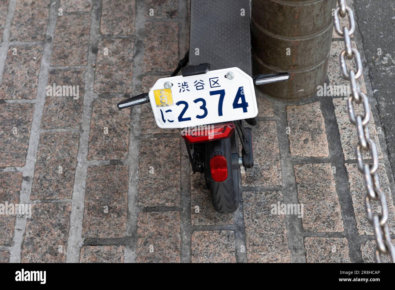 Tokyo, Japan. 3rd Mar, 2023. An electric scooter with registration vehicle tags license plates