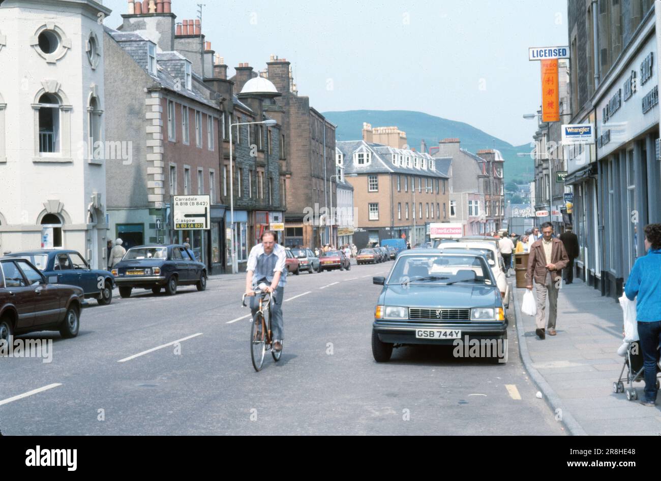 Campbeltown, Scotland, United Kingdom- July 1983:view down Main Street in Campbeltown, view of buildings and shops. Stock Photo