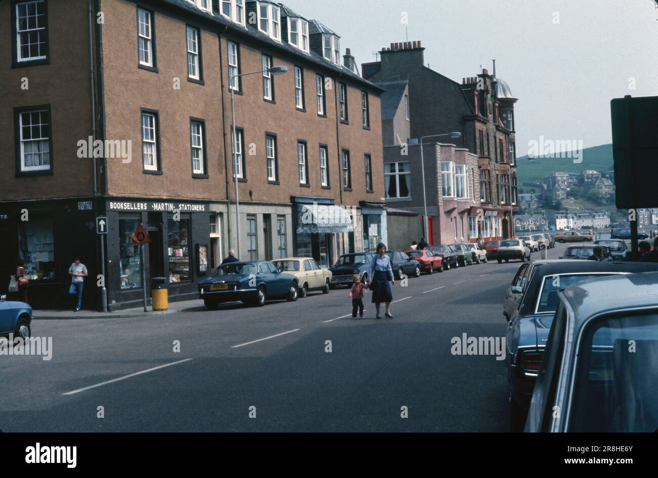 Campbeltown, Scotland, United Kingdom- July 1983: Intersection of Bolgam and Main streets in Campbeltown, view of buildings and shops. Stock Photo