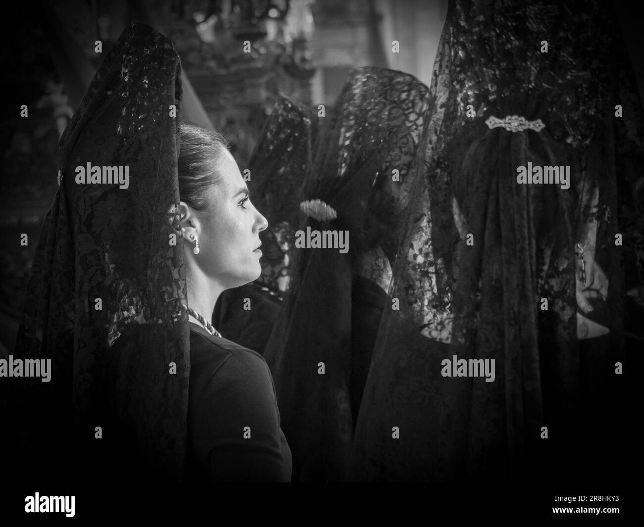 Woman with mantilla and comb in the processional parades in the streets