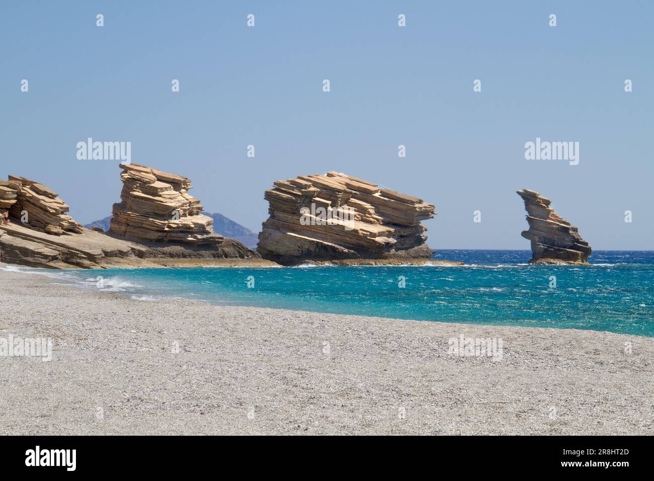 Triopetra, cliffs of platy sandstone on Crete in a turquoise sea Stock Photo