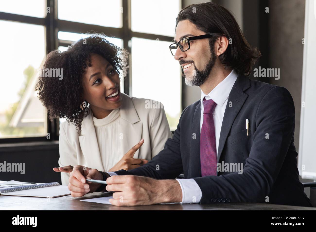 Cheerful multiracial team having fun during conference, office interior Stock Photo