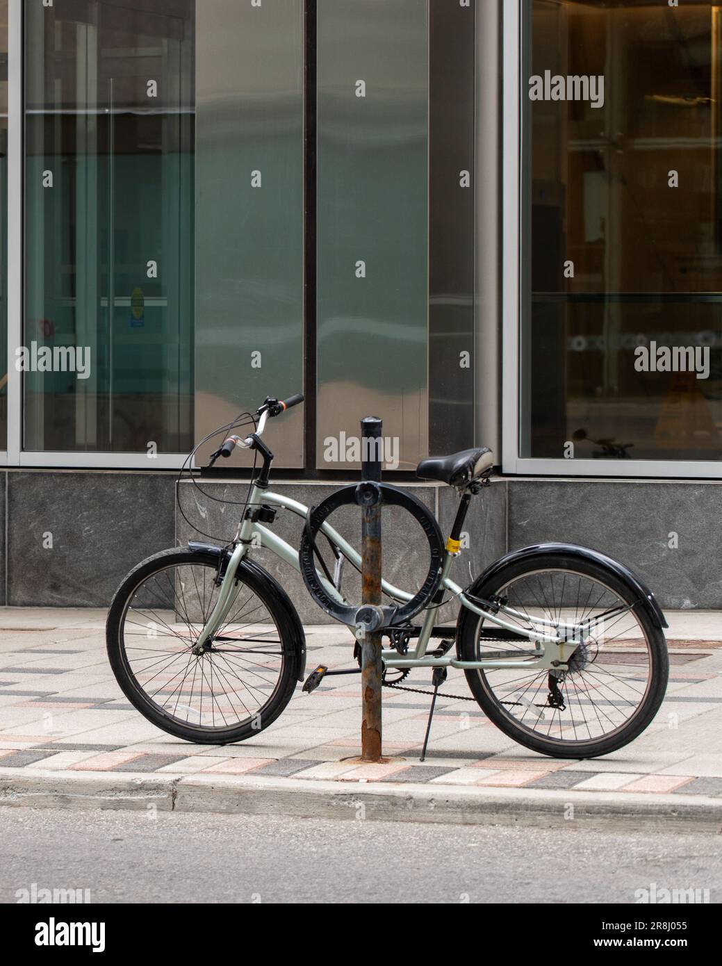 Ottawa, Canada May 19, 2023 Bike parked in the city on sidewalk at