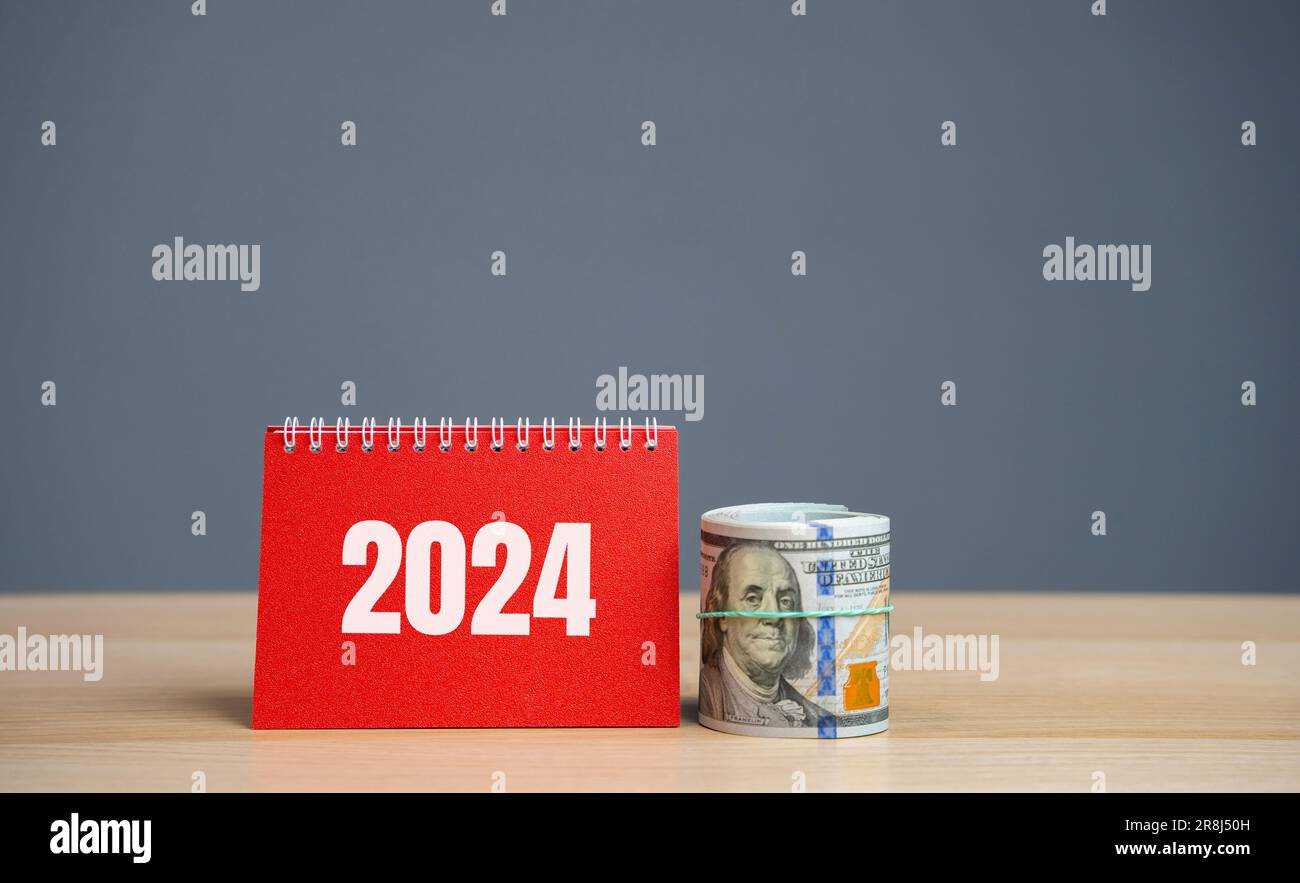 Notes 2024 and dollar bills. Budget planning concept. Financial goals