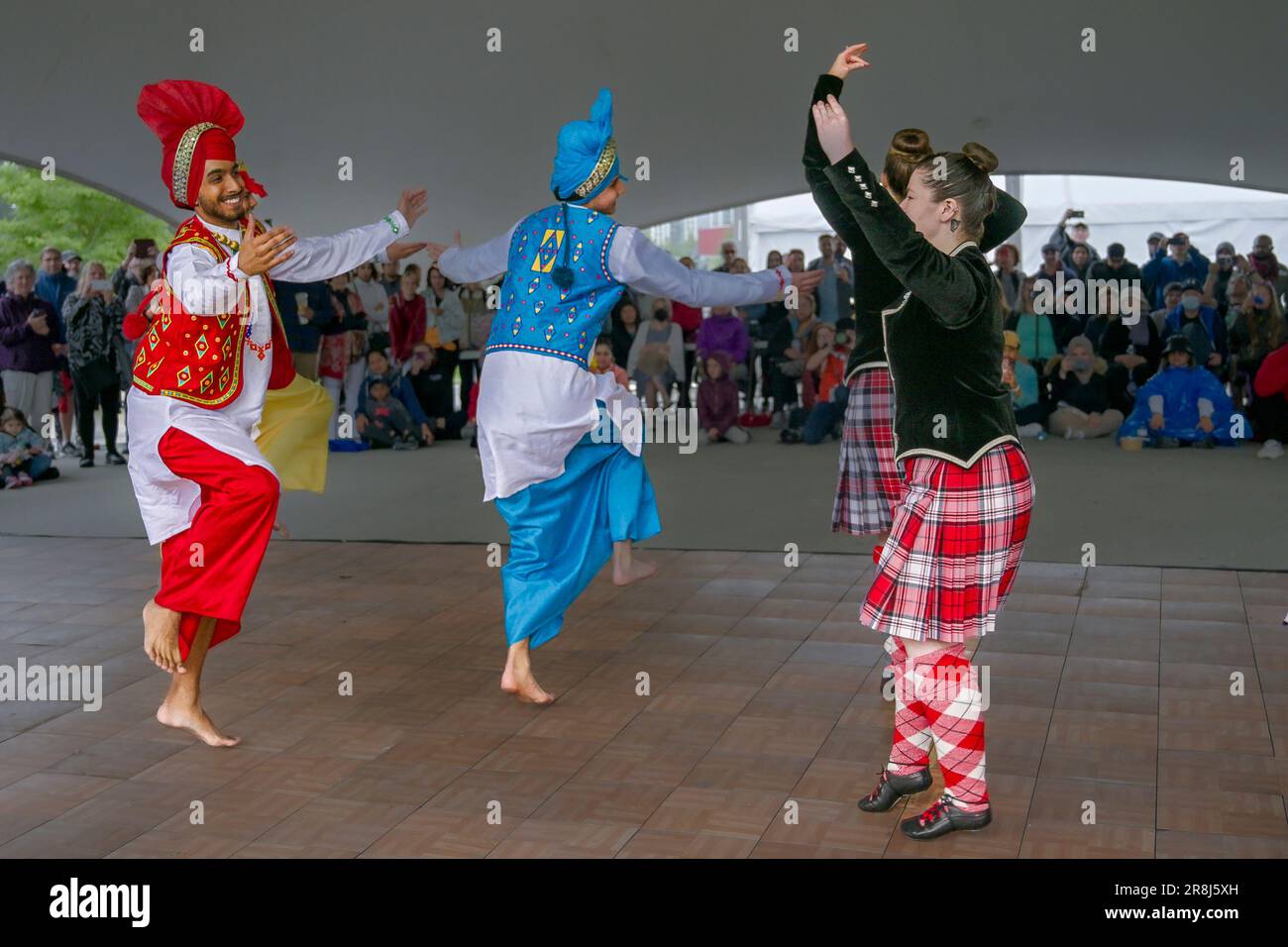 Dance Fusion collaboration with Highland and Punjabi Bhangra dancers, Scotfest,Town Centre Park, Coquitlam, British Columbia, Canada, Stock Photo