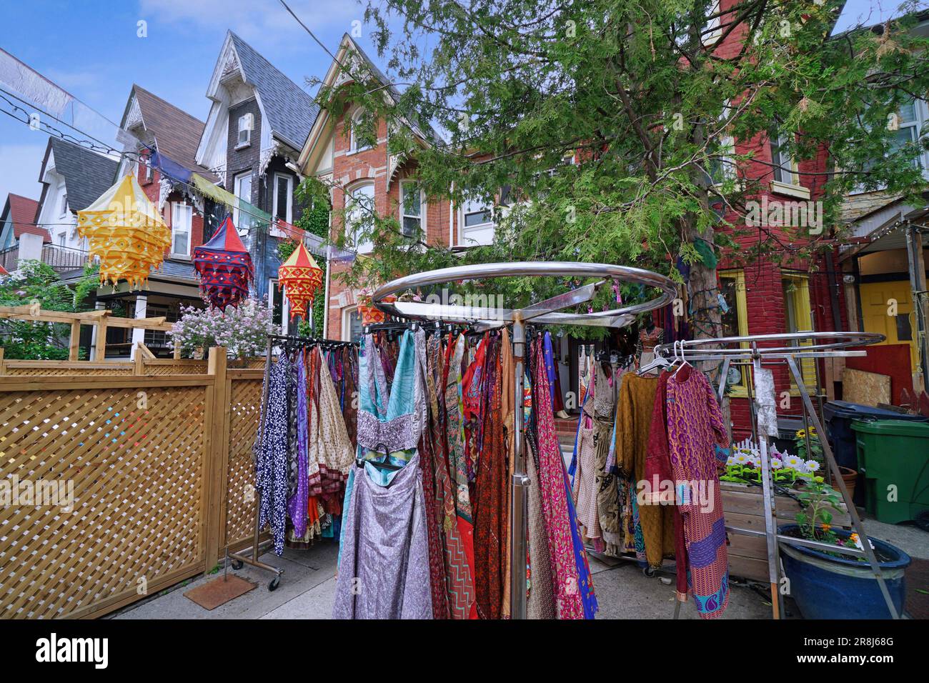 Colorful dresses for sale in the Kensington Market area where old houses have been converted to stores Stock Photo