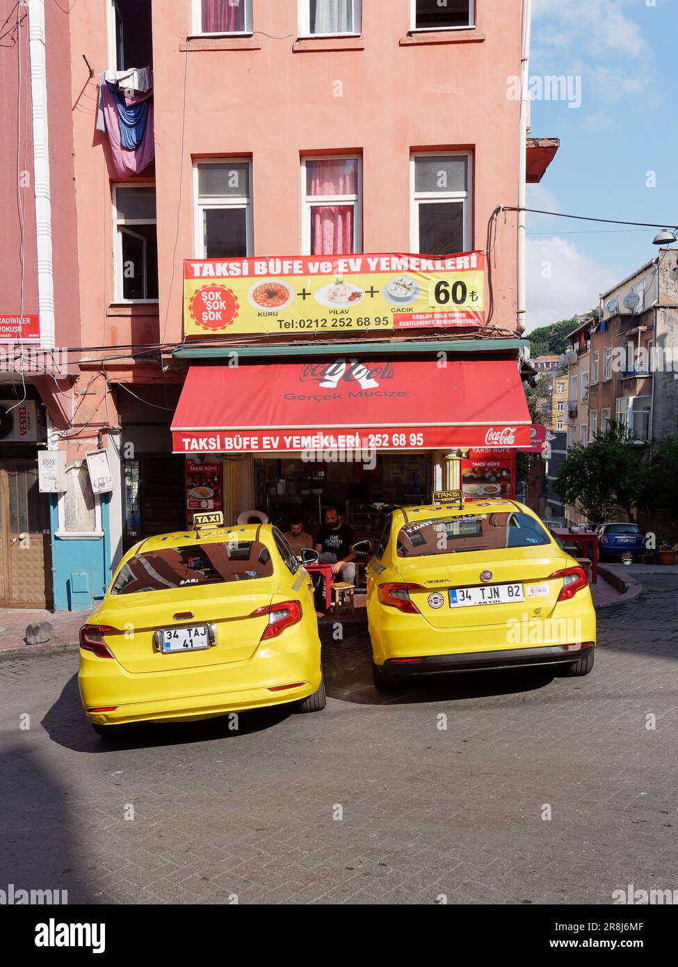 Yellow Taxis parked outside a Taxi Cafe in Istanbul, Turkey Stock Photo