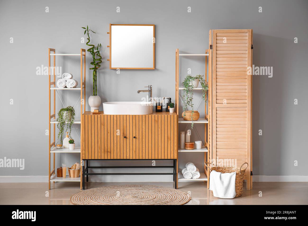 Interior of bathroom with sink, drawers and shelving units Stock Photo ...