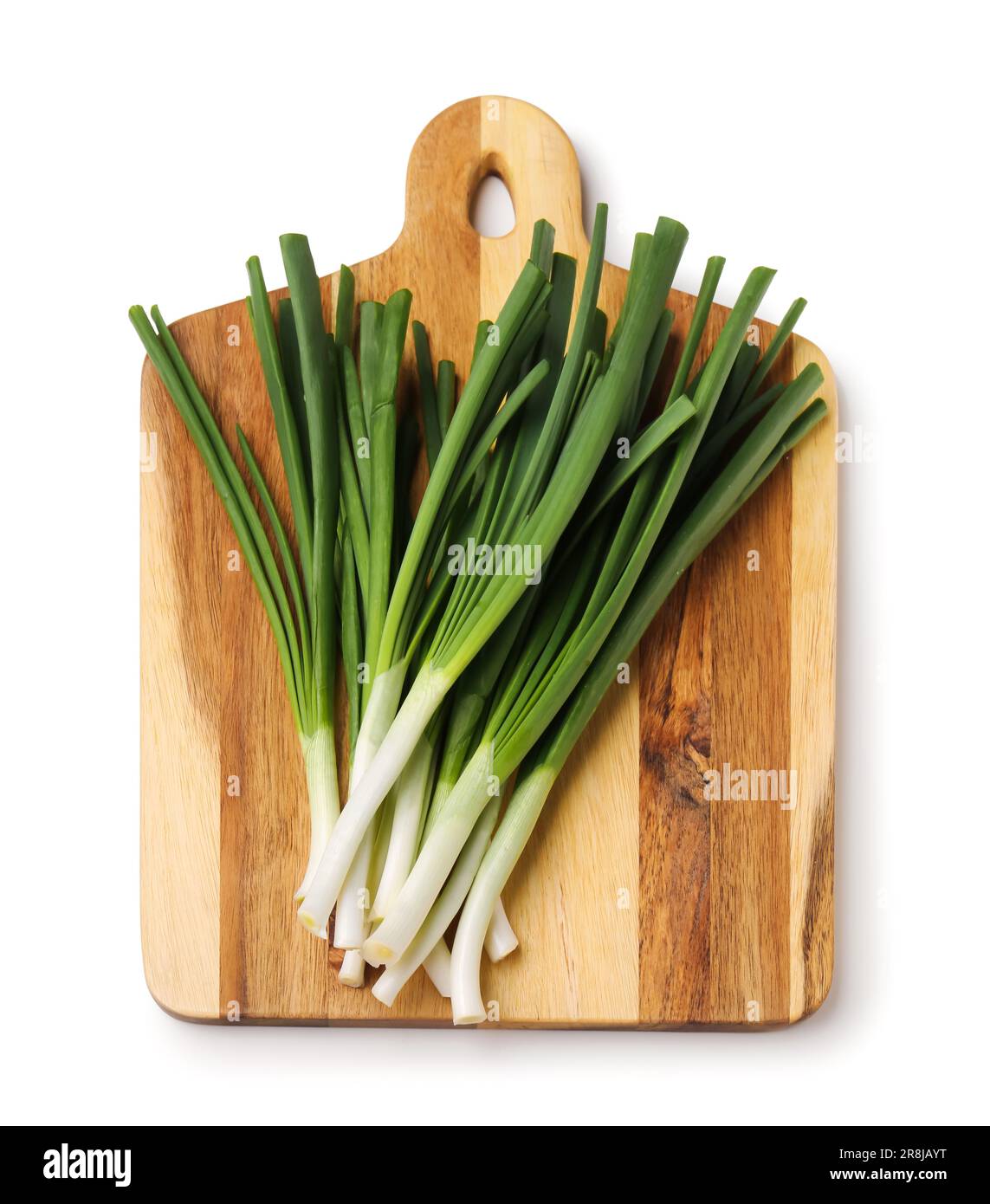 Wooden board with fresh green onion isolated on white background Stock ...