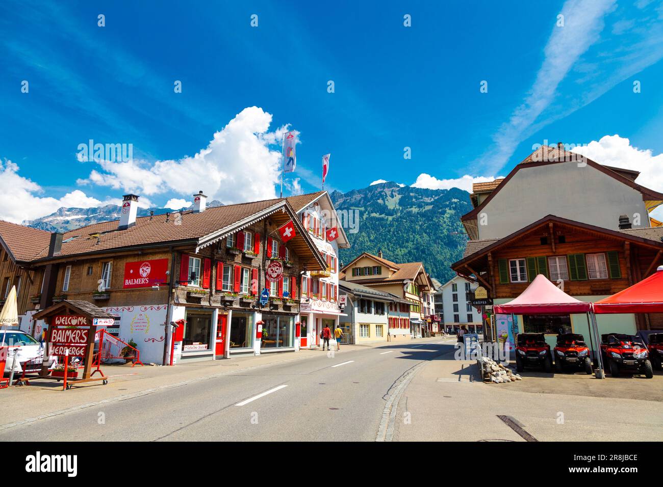Restaurants in traditional Swiss houses along Hauptstrasse, Matten bei Interlaken, Switzerland Stock Photo