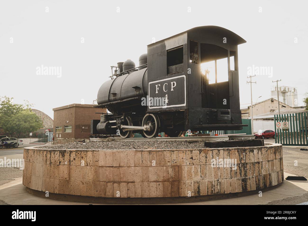 Old coal and steam train machine exhibited in the courtyards in ...