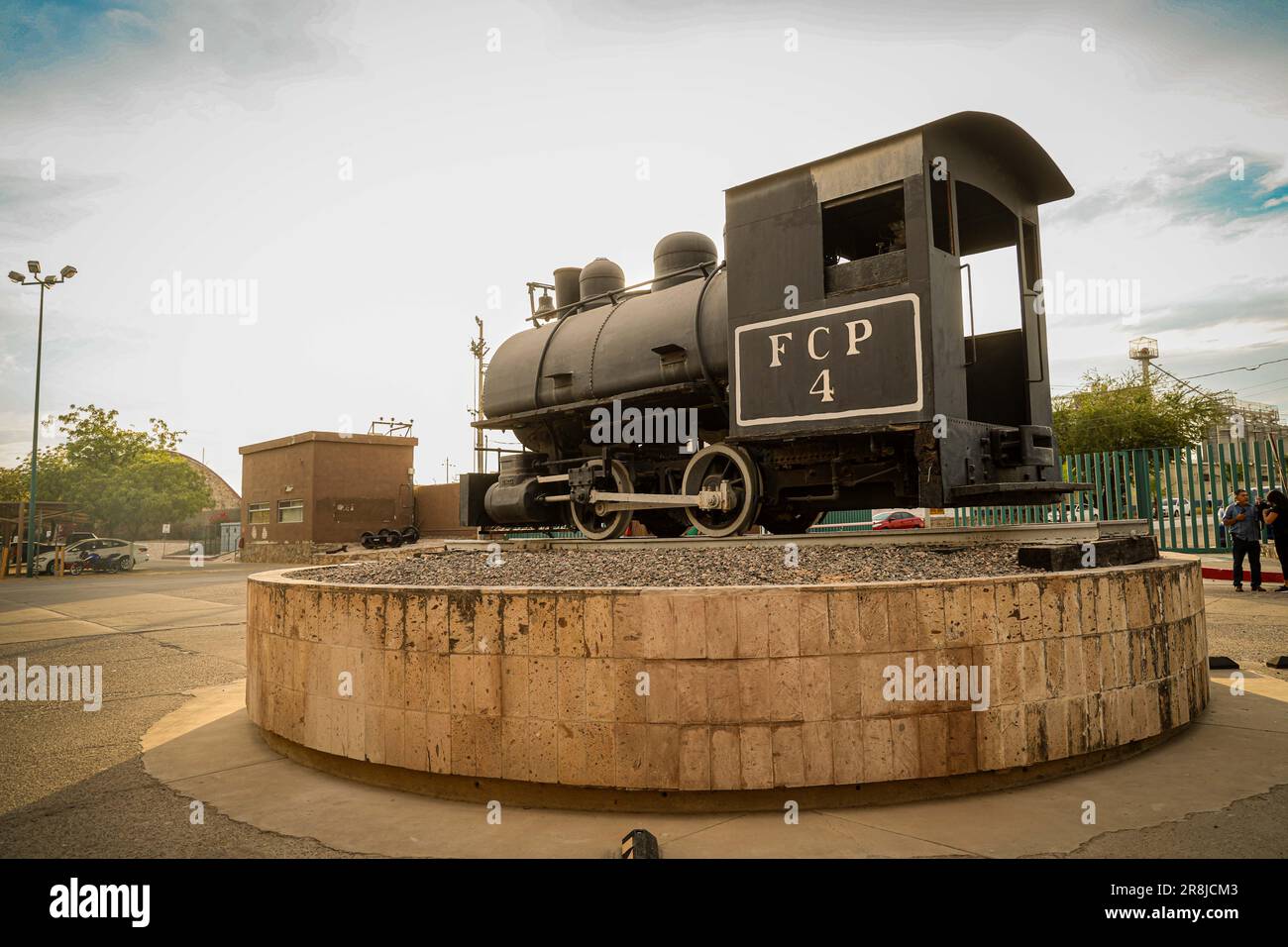 Old coal and steam train machine exhibited in the courtyards in ...
