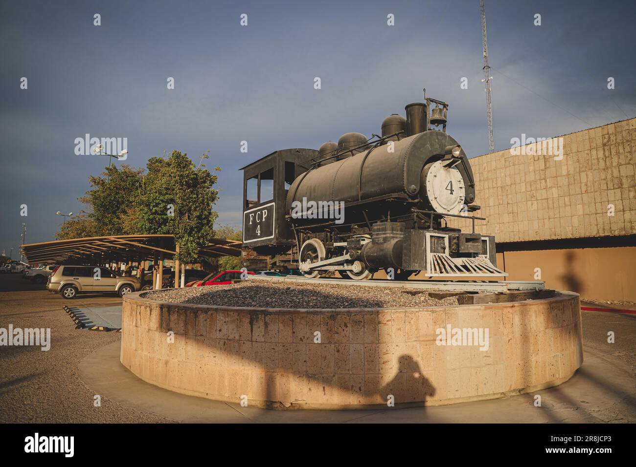 Old coal and steam train machine exhibited in the courtyards in ...