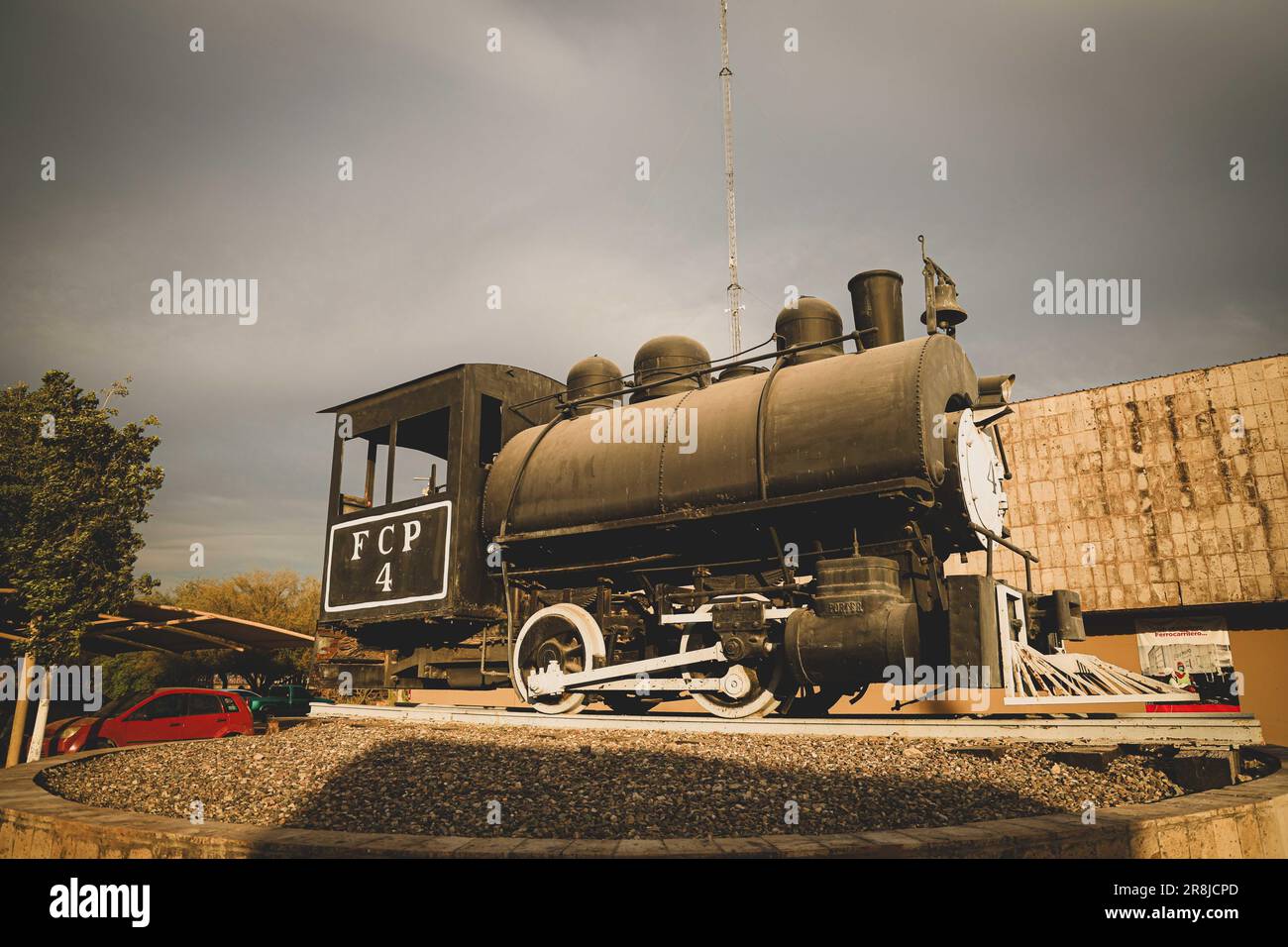 Old coal and steam train machine exhibited in the courtyards in ...