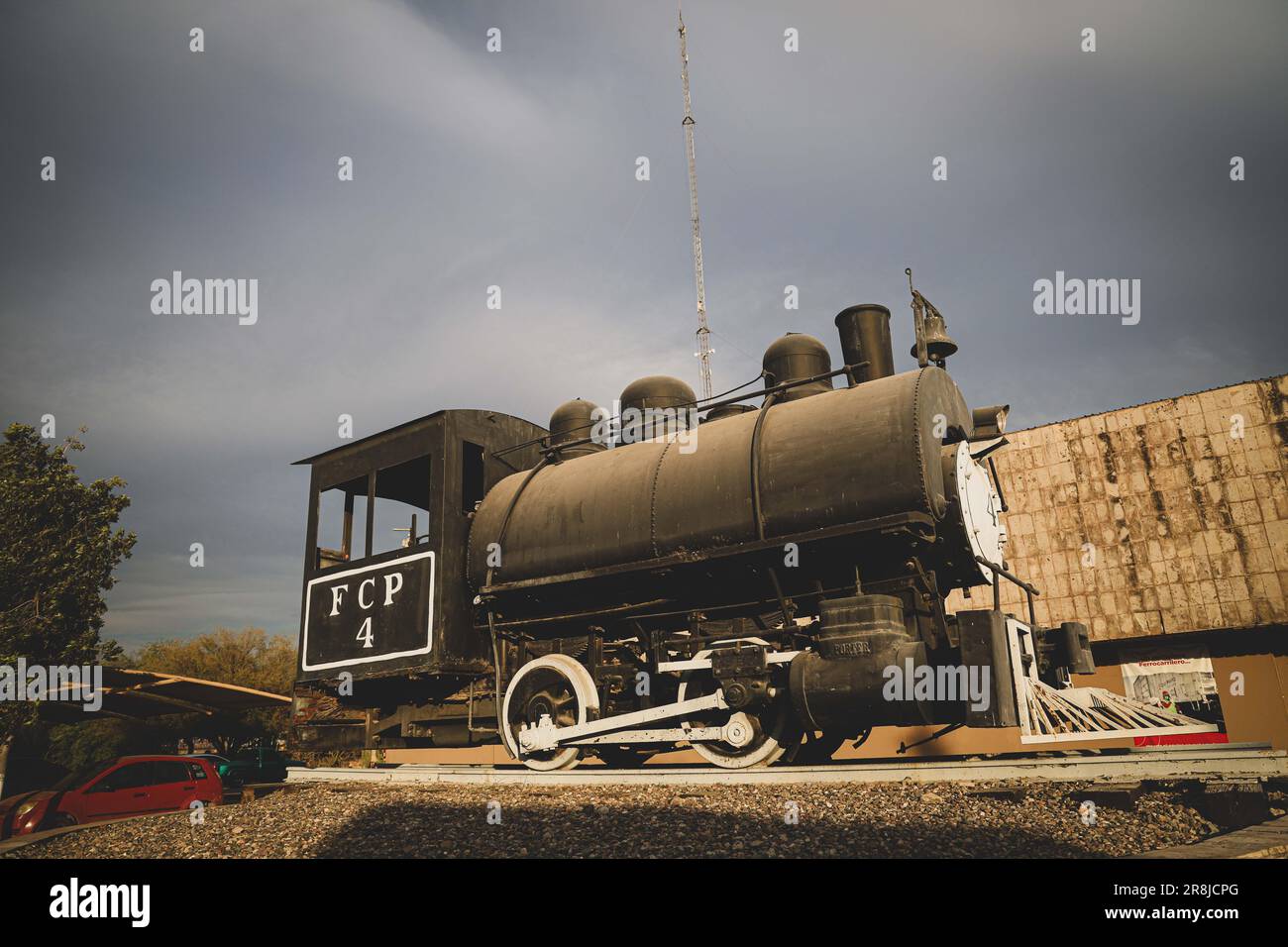 Old coal and steam train machine exhibited in the courtyards in ...