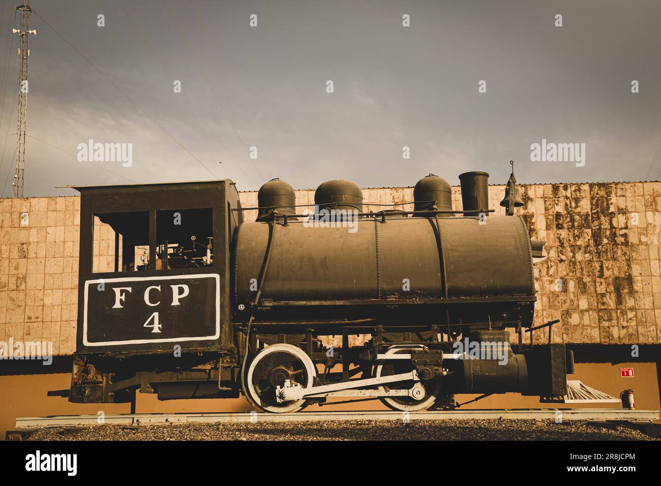 Old coal and steam train machine exhibited in the courtyards in ...