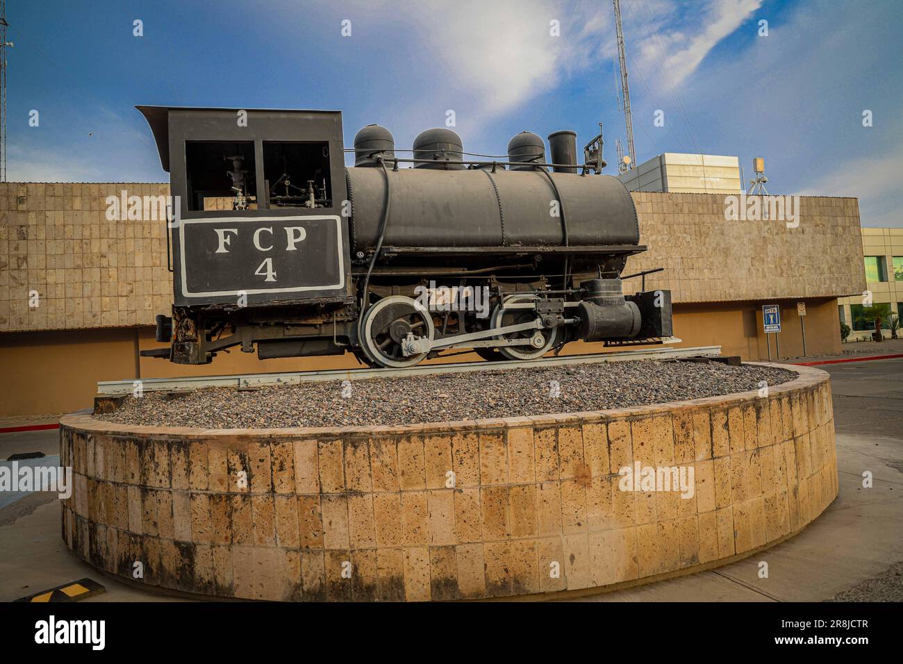Old coal and steam train machine exhibited in the courtyards in ...