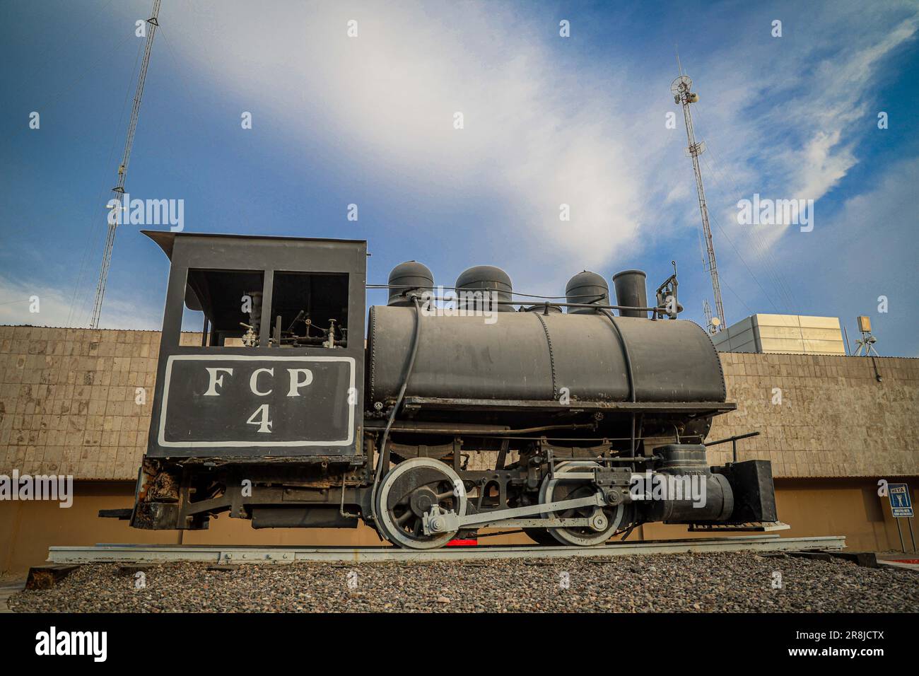 Old coal and steam train machine exhibited in the courtyards in ...