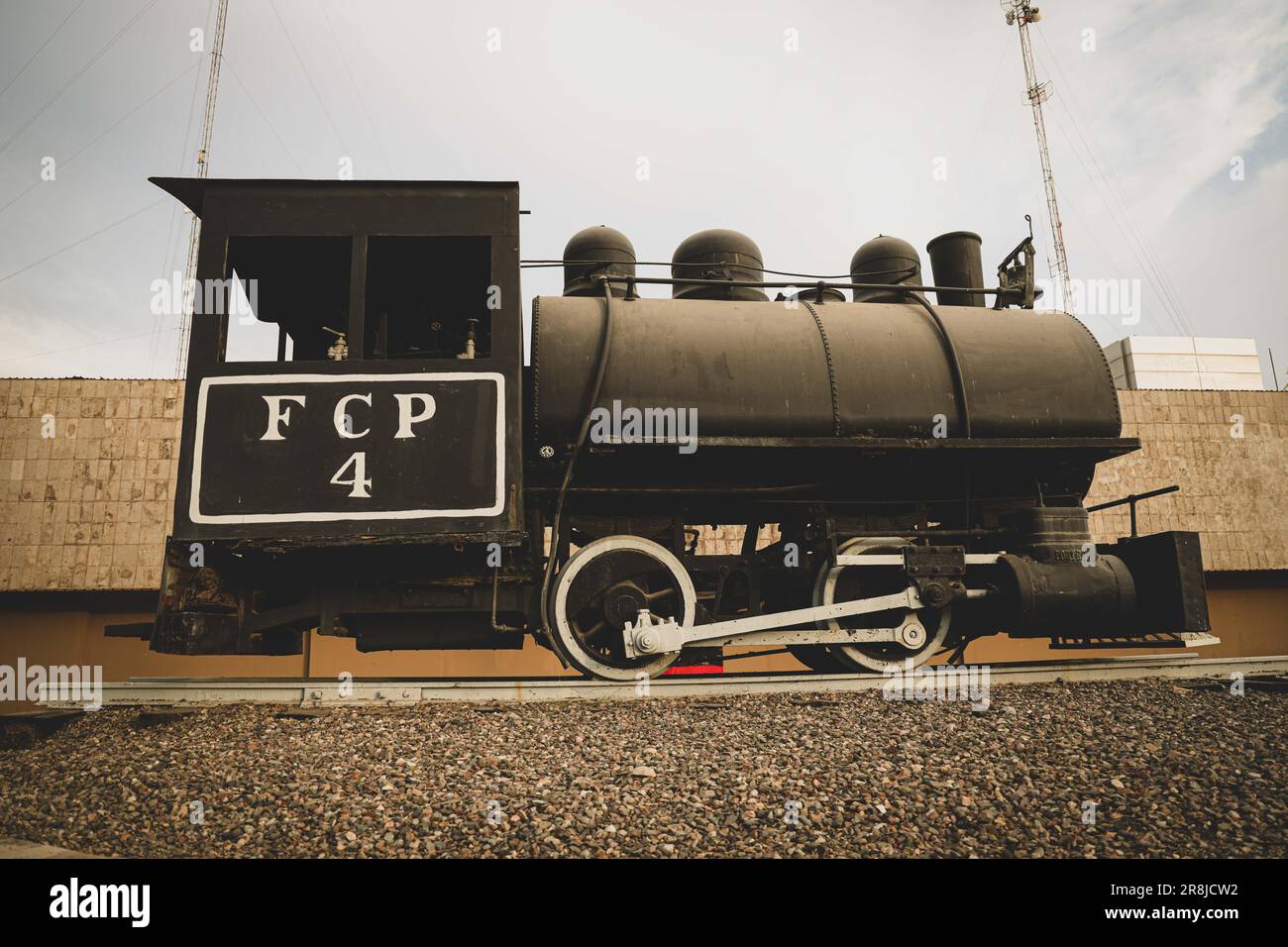 Old coal and steam train machine exhibited in the courtyards in ...