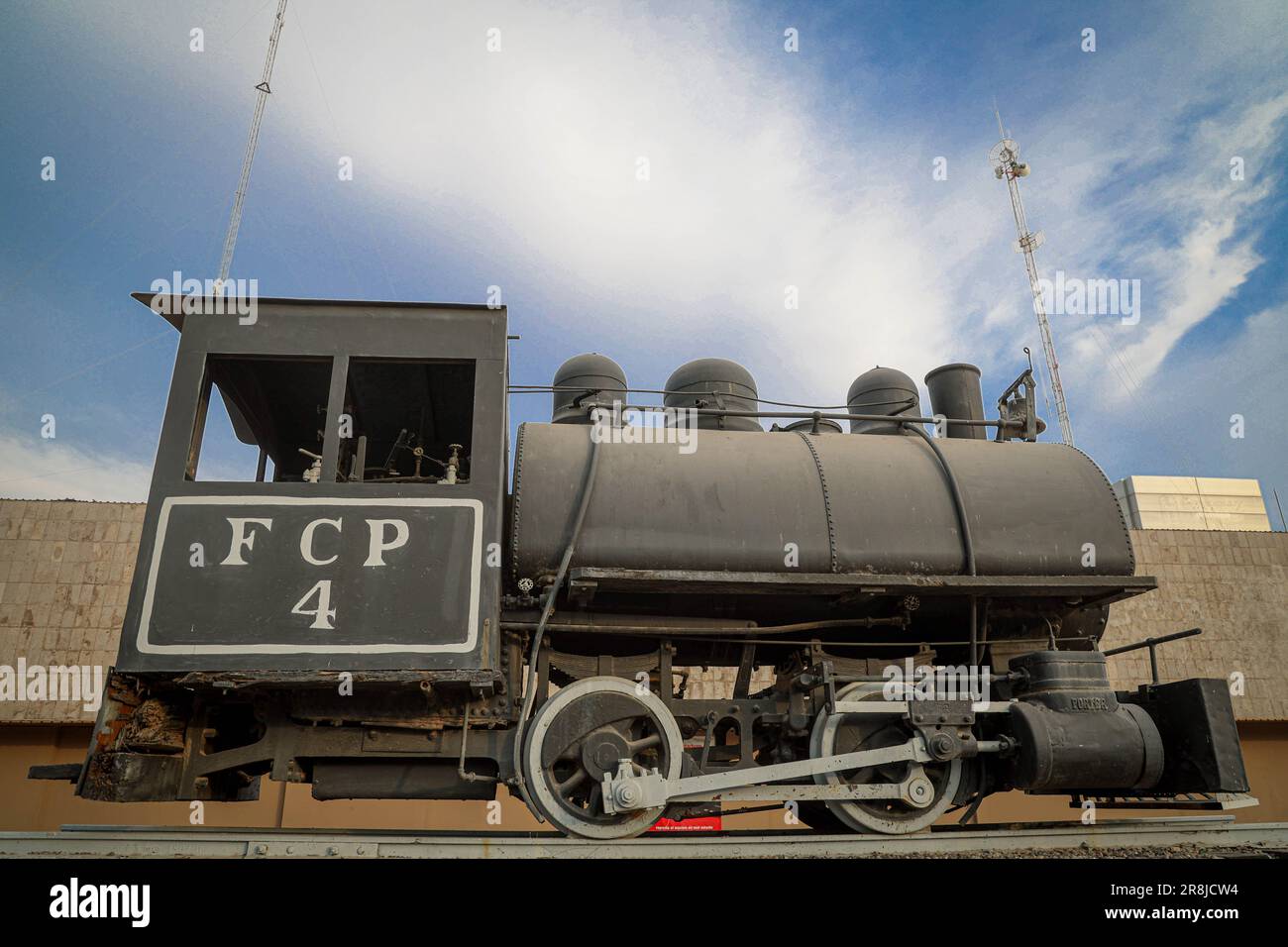 Old coal and steam train machine exhibited in the courtyards in ...