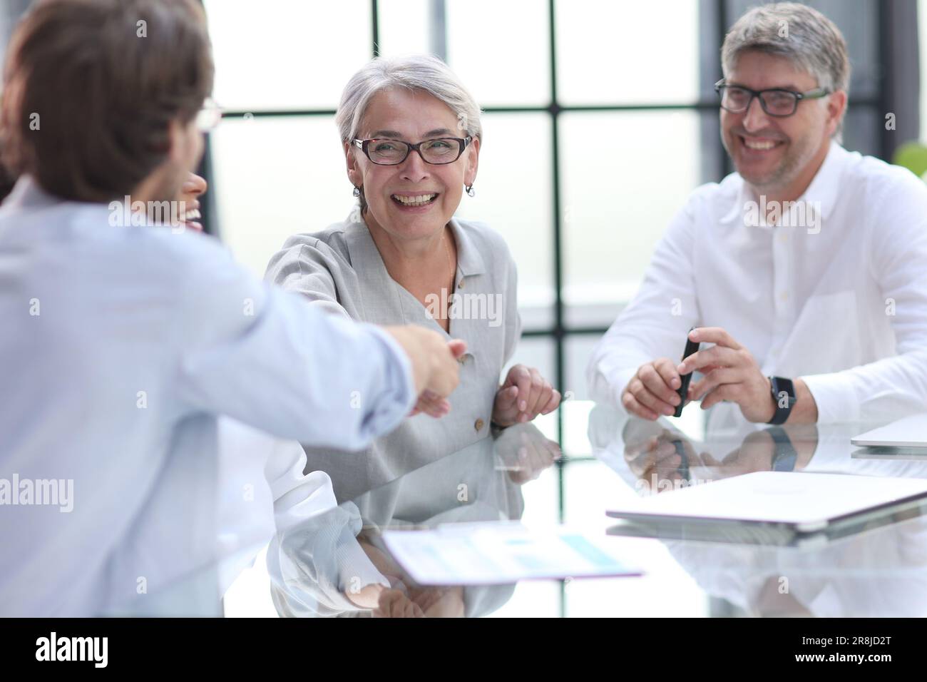 discussion of business people in the office sitting at the table Stock Photo