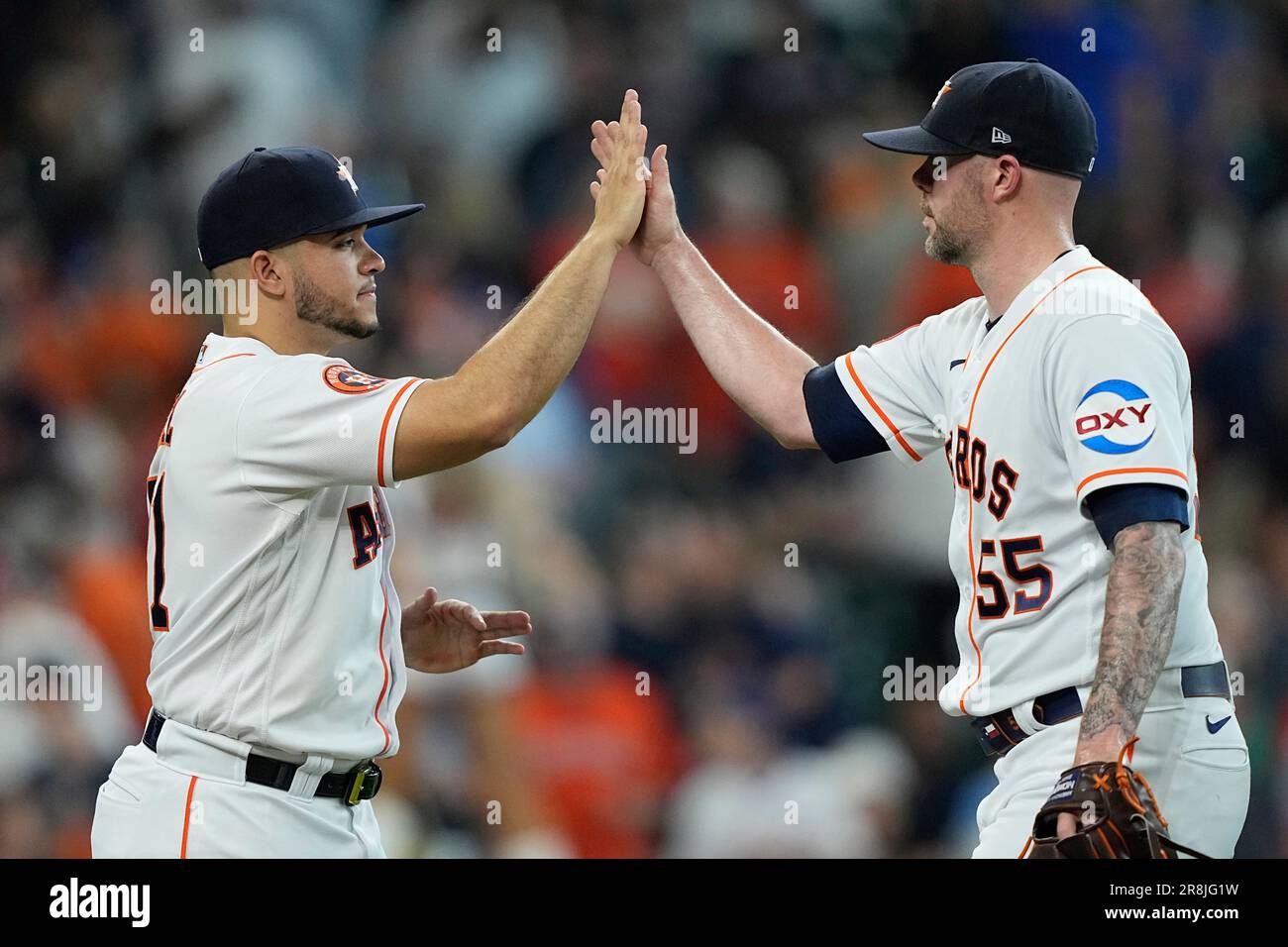 Houston Astros' Ryan Pressly (55) and Yainer Diaz celebrate after