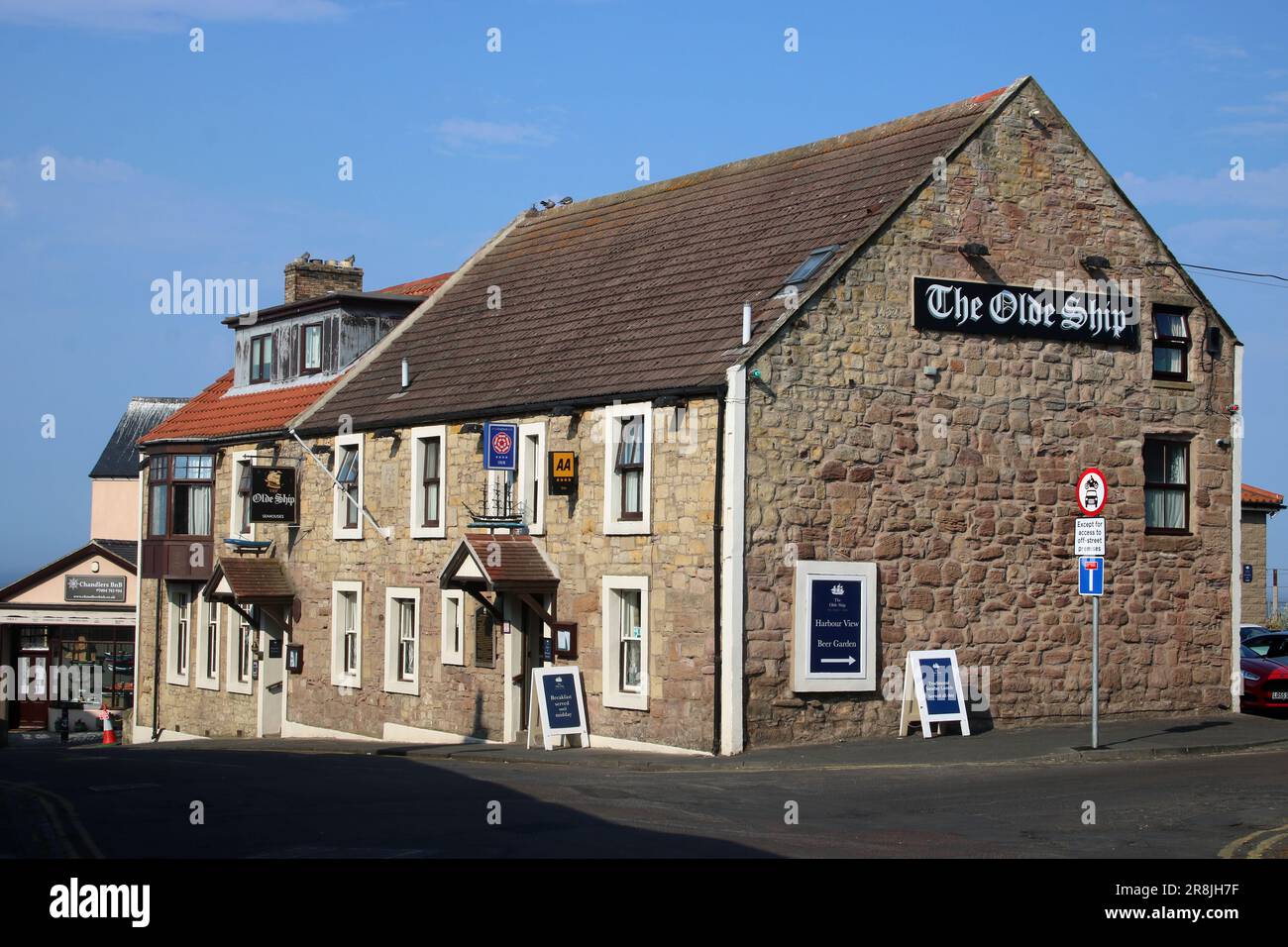 View of the Olde Ship Inn on Main Street in Seahouses, Northumberland on a sunny June evening. Stock Photo