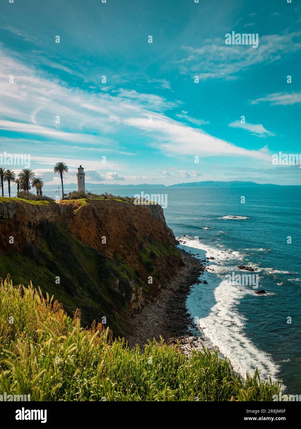 A picturesque coastal landscape with the Point Vicente lighthouse ...