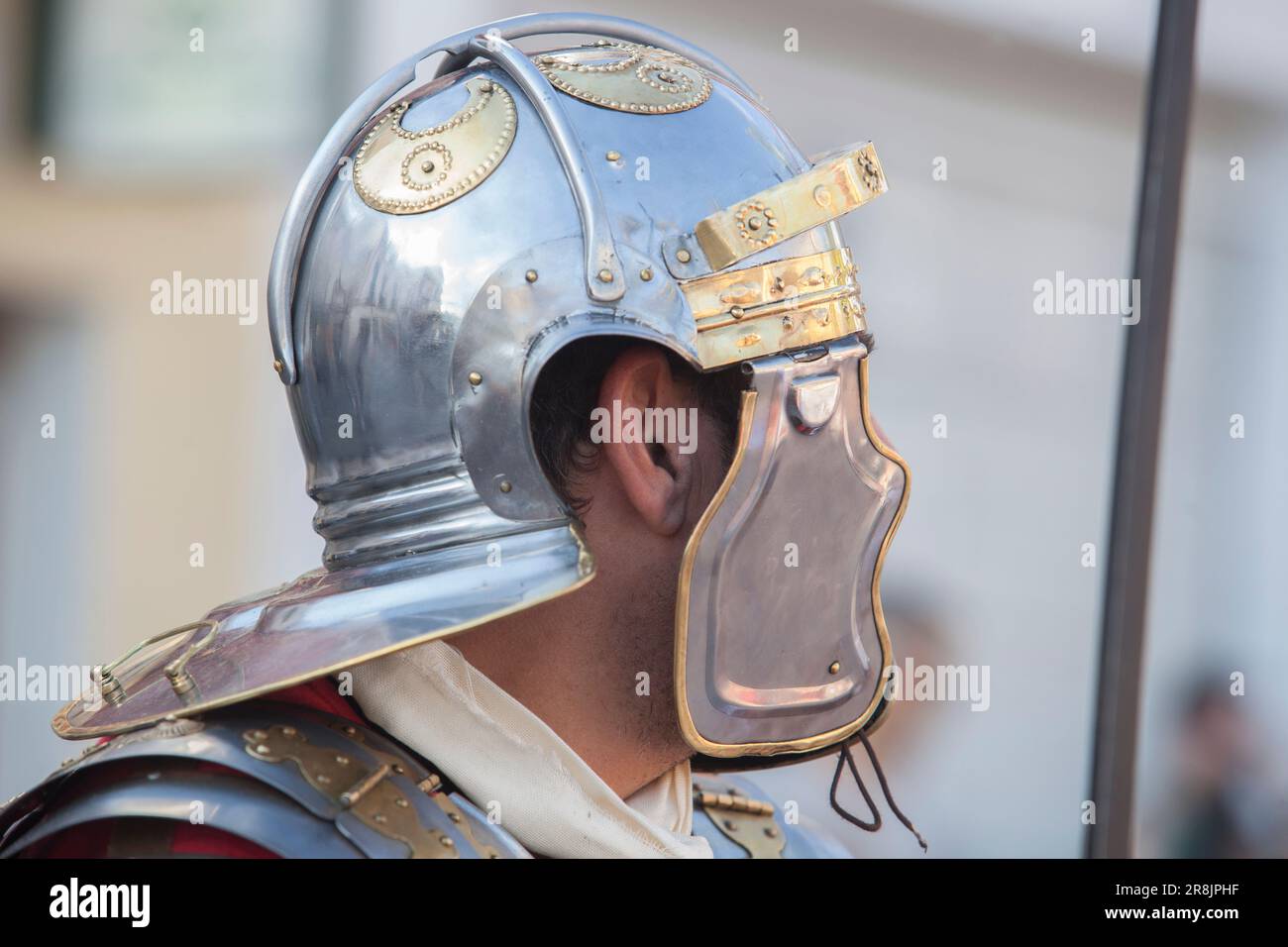 Reenactor wearing a galea, ancient roman helmet. Roman military personal equipment replica Stock Photo