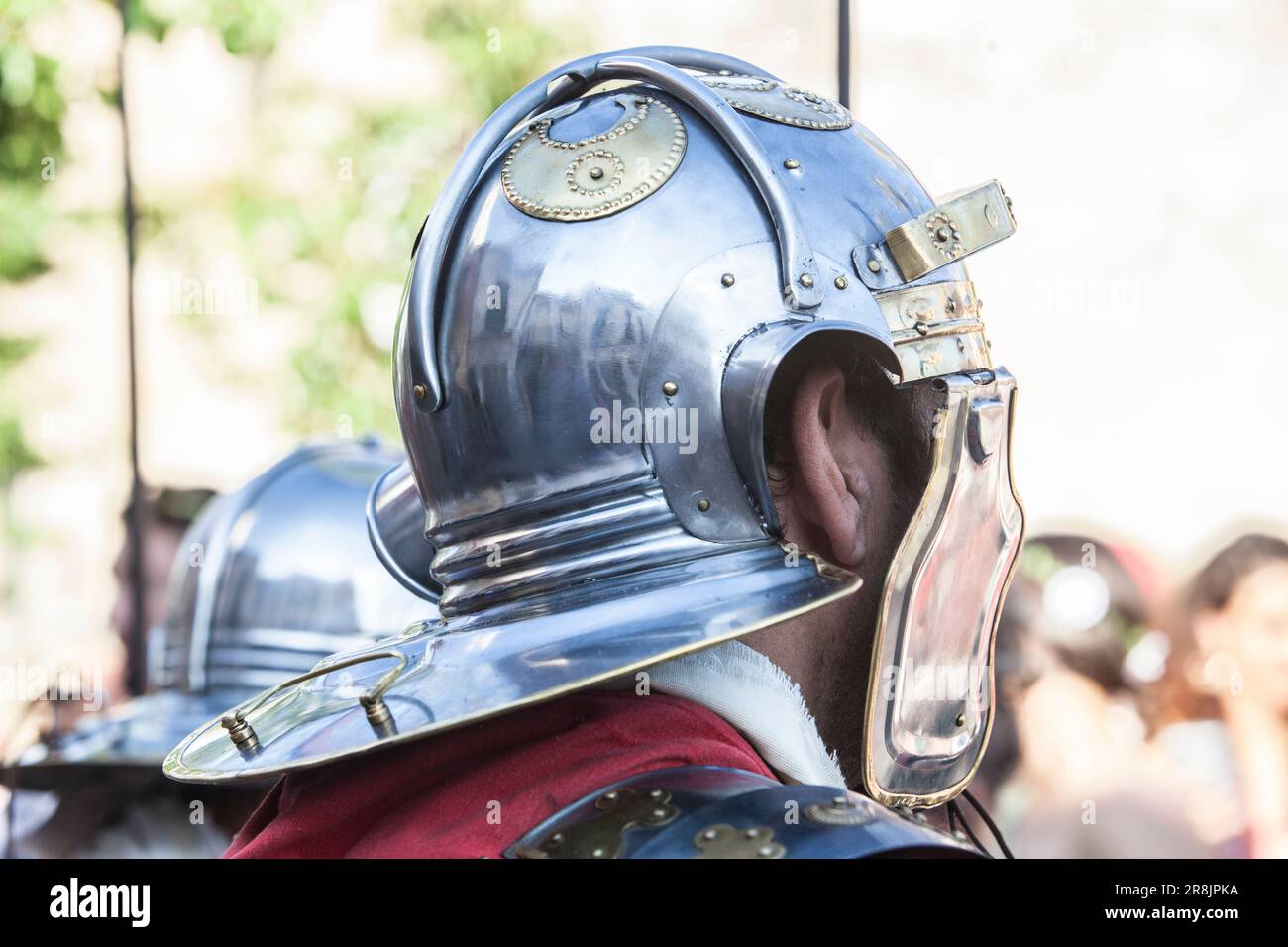 Reenactors wearing a galea, ancient roman helmet. Roman military personal equipment replica Stock Photo